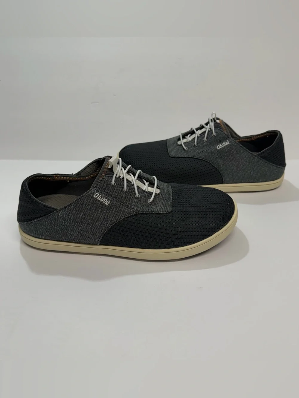 OluKai Men's Black and Cream Casual Perforated Slip-On Sneakers